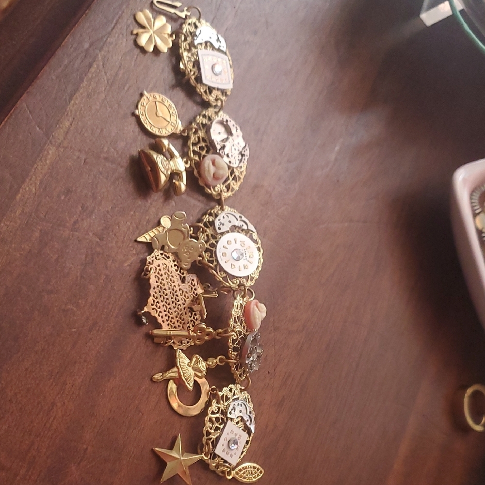 Vintage Gold Charm Bracelet with Intricate Designs